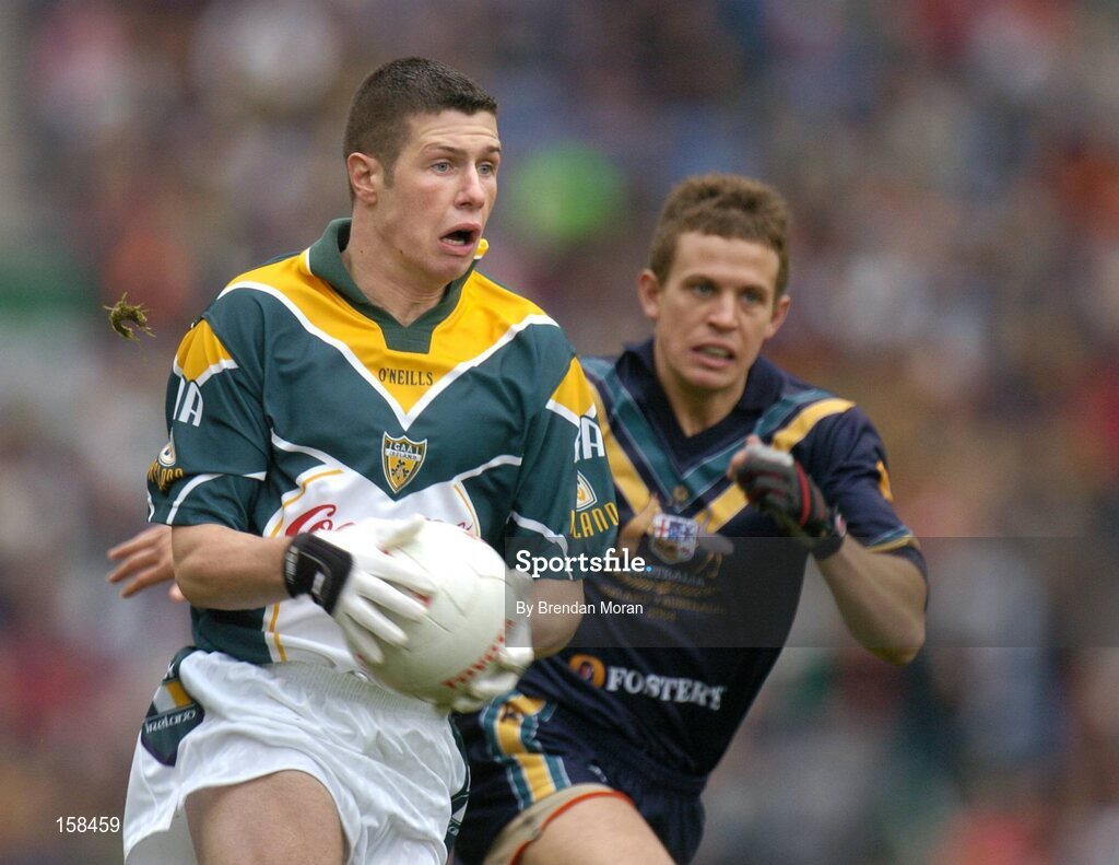 17 October 2004; Sean Cavanagh, Ireland, in action against Luke Ball, Australia. Coca Cola International Rules Series 2004, First Test, Ireland v Australia, Croke Park, Dublin. Picture credit; Brendan Moran / SPORTSFILE *** Local Caption *** Any photograph taken by SPORTSFILE during, or in connection with, the 2004 Coca Cola International Rules Series which displays GAA logos or contains an image or part of an image of any GAA intellectual property, or, which contains images of a GAA player/players in their playing uniforms, may only be used for editorial and non-advertising purposes.  Use of photographs for advertising, as posters or for purchase separately is strictly prohibited unless prior written approval has been obtained from the Gaelic Athletic Association.