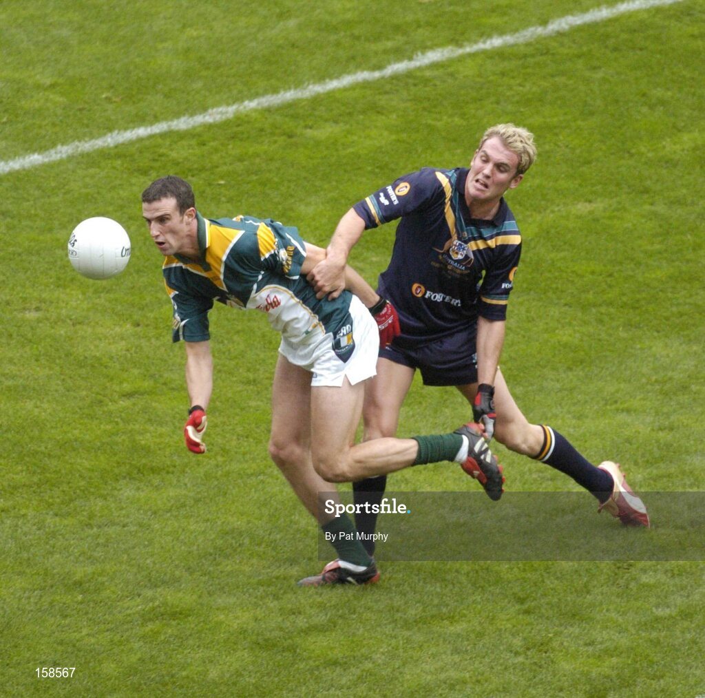 17 October 2004; Joe Bergin, Ireland, in action against Cameron Bruce, Australia. Coca Cola International Rules Series 2004, First Test, Ireland v Australia, Croke Park, Dublin. Picture credit; Pat Murphy / SPORTSFILE *** Local Caption *** Any photograph taken by SPORTSFILE during, or in connection with, the 2004 Coca Cola International Rules Series, which displays GAA logos or contains an image or part of an image of any GAA intellectual property, or, which contains images of a GAA player/players in their playing uniforms, may only be used for editorial and non-advertising purposes.  Use of photographs for advertising, as posters or for purchase separately is strictly prohibited unless prior written approval has been obtained from the Gaelic Athletic Association.