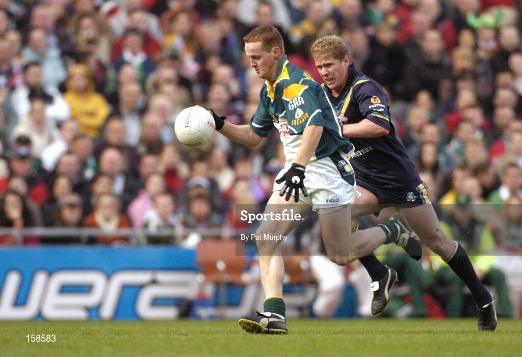 17 October 2004; Brendan Coulter, Ireland, in action against Jason Johnson, Australia. Coca Cola International Rules Series 2004, First Test, Ireland v Australia, Croke Park, Dublin. Picture credit; Pat Murphy / SPORTSFILE *** Local Caption *** Any photograph taken by SPORTSFILE during, or in connection with, the 2004 Coca Cola International Rules Series, which displays GAA logos or contains an image or part of an image of any GAA intellectual property, or, which contains images of a GAA player/players in their playing uniforms, may only be used for editorial and non-advertising purposes.  Use of photographs for advertising, as posters or for purchase separately is strictly prohibited unless prior written approval has been obtained from the Gaelic Athletic Association.