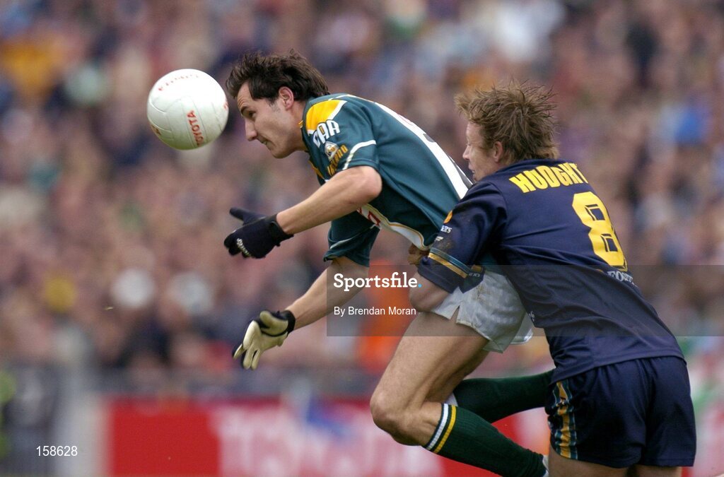 17 October 2004; Tadhg Kennelly, Ireland, in action against Max Hudghton, Australia. Coca Cola International Rules Series 2004, First Test, Ireland v Australia, Croke Park, Dublin. Picture credit; Brendan Moran / SPORTSFILE *** Local Caption *** Any photograph taken by SPORTSFILE during, or in connection with, the 2004 Coca Cola International Rules Series which displays GAA logos or contains an image or part of an image of any GAA intellectual property, or, which contains images of a GAA player/players in their playing uniforms, may only be used for editorial and non-advertising purposes.  Use of photographs for advertising, as posters or for purchase separately is strictly prohibited unless prior written approval has been obtained from the Gaelic Athletic Association.