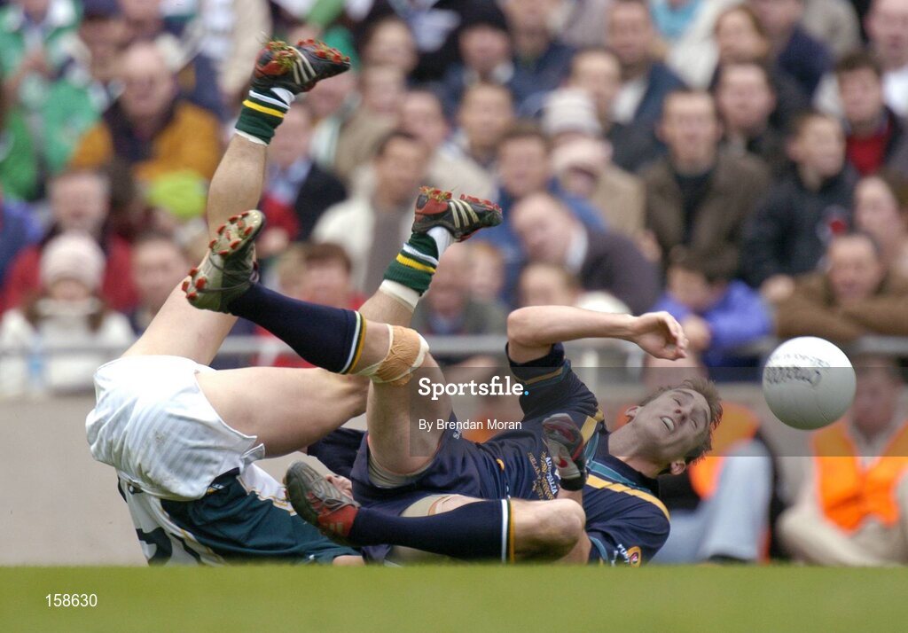 17 October 2004; Robert Haddrill, Australia, is tackled by Paul Galvin, Ireland. Coca Cola International Rules Series 2004, First Test, Ireland v Australia, Croke Park, Dublin. Picture credit; Brendan Moran / SPORTSFILE *** Local Caption *** Any photograph taken by SPORTSFILE during, or in connection with, the 2004 Coca Cola International Rules Series which displays GAA logos or contains an image or part of an image of any GAA intellectual property, or, which contains images of a GAA player/players in their playing uniforms, may only be used for editorial and non-advertising purposes.  Use of photographs for advertising, as posters or for purchase separately is strictly prohibited unless prior written approval has been obtained from the Gaelic Athletic Association.