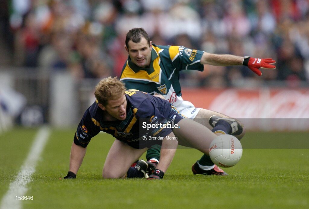 17 October 2004; Jason Johnson, Australia, in action against Steven McDonnell, Ireland. Coca Cola International Rules Series 2004, First Test, Ireland v Australia, Croke Park, Dublin. Picture credit; Brendan Moran / SPORTSFILE *** Local Caption *** Any photograph taken by SPORTSFILE during, or in connection with, the 2004 Coca Cola International Rules Series which displays GAA logos or contains an image or part of an image of any GAA intellectual property, or, which contains images of a GAA player/players in their playing uniforms, may only be used for editorial and non-advertising purposes.  Use of photographs for advertising, as posters or for purchase separately is strictly prohibited unless prior written approval has been obtained from the Gaelic Athletic Association.