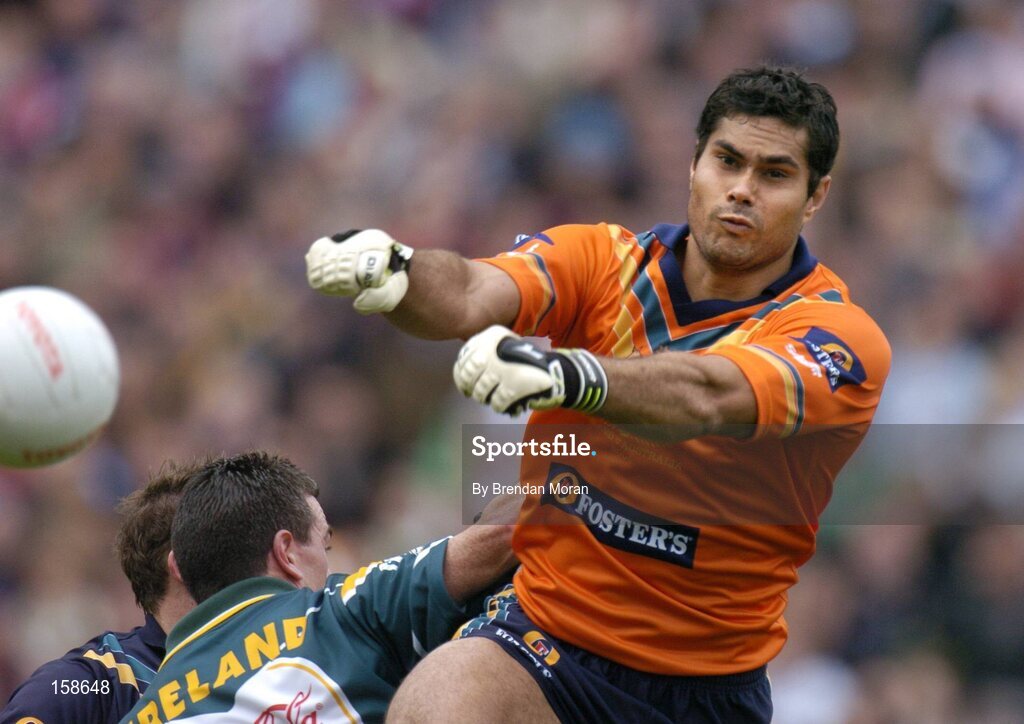 17 October 2004; Mal Michael, Australia, in action against Padraic Joyce, Ireland. Coca Cola International Rules Series 2004, First Test, Ireland v Australia, Croke Park, Dublin. Picture credit; Brendan Moran / SPORTSFILE *** Local Caption *** Any photograph taken by SPORTSFILE during, or in connection with, the 2004 Coca Cola International Rules Series which displays GAA logos or contains an image or part of an image of any GAA intellectual property, or, which contains images of a GAA player/players in their playing uniforms, may only be used for editorial and non-advertising purposes.  Use of photographs for advertising, as posters or for purchase separately is strictly prohibited unless prior written approval has been obtained from the Gaelic Athletic Association.