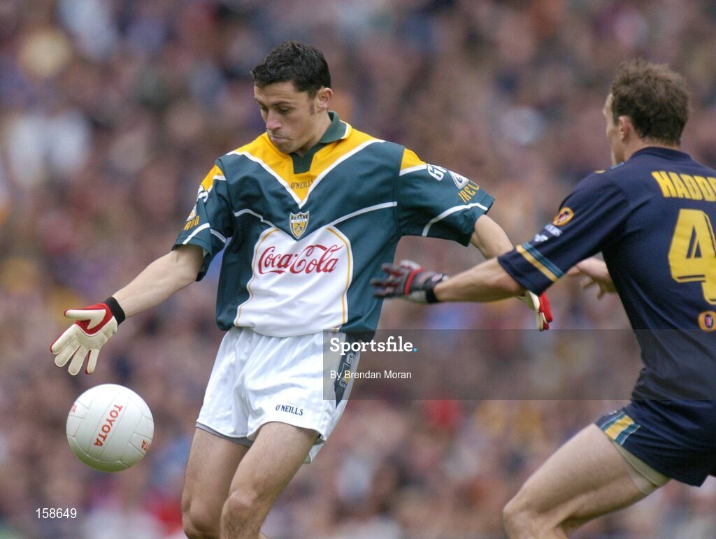 17 October 2004; Alan Brogan, Ireland, in action against Robert Haddrill, Australia. Coca Cola International Rules Series 2004, First Test, Ireland v Australia, Croke Park, Dublin. Picture credit; Brendan Moran / SPORTSFILE *** Local Caption *** Any photograph taken by SPORTSFILE during, or in connection with, the 2004 Coca Cola International Rules Series which displays GAA logos or contains an image or part of an image of any GAA intellectual property, or, which contains images of a GAA player/players in their playing uniforms, may only be used for editorial and non-advertising purposes.  Use of photographs for advertising, as posters or for purchase separately is strictly prohibited unless prior written approval has been obtained from the Gaelic Athletic Association.