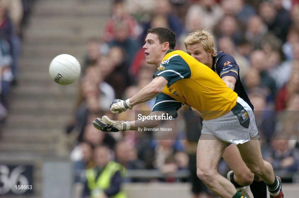 17 October 2004; Stephen Cluxton, Ireland, in action against Nick Riewoldt, Australia. Coca Cola International Rules Series 2004, First Test, Ireland v Australia, Croke Park, Dublin. Picture credit; Brendan Moran / SPORTSFILE *** Local Caption *** Any photograph taken by SPORTSFILE during, or in connection with, the 2004 Coca Cola International Rules Series which displays GAA logos or contains an image or part of an image of any GAA intellectual property, or, which contains images of a GAA player/players in their playing uniforms, may only be used for editorial and non-advertising purposes.  Use of photographs for advertising, as posters or for purchase separately is strictly prohibited unless prior written approval has been obtained from the Gaelic Athletic Association.
