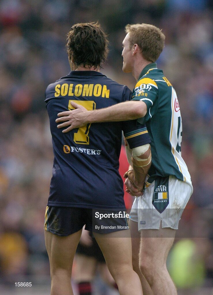 17 October 2004; David Heaney, Ireland, shakes hands with Dean Solomon, Australia, after the final whistle. Coca Cola International Rules Series 2004, First Test, Ireland v Australia, Croke Park, Dublin. Picture credit; Brendan Moran / SPORTSFILE *** Local Caption *** Any photograph taken by SPORTSFILE during, or in connection with, the 2004 Coca Cola International Rules Series which displays GAA logos or contains an image or part of an image of any GAA intellectual property, or, which contains images of a GAA player/players in their playing uniforms, may only be used for editorial and non-advertising purposes.  Use of photographs for advertising, as posters or for purchase separately is strictly prohibited unless prior written approval has been obtained from the Gaelic Athletic Association.