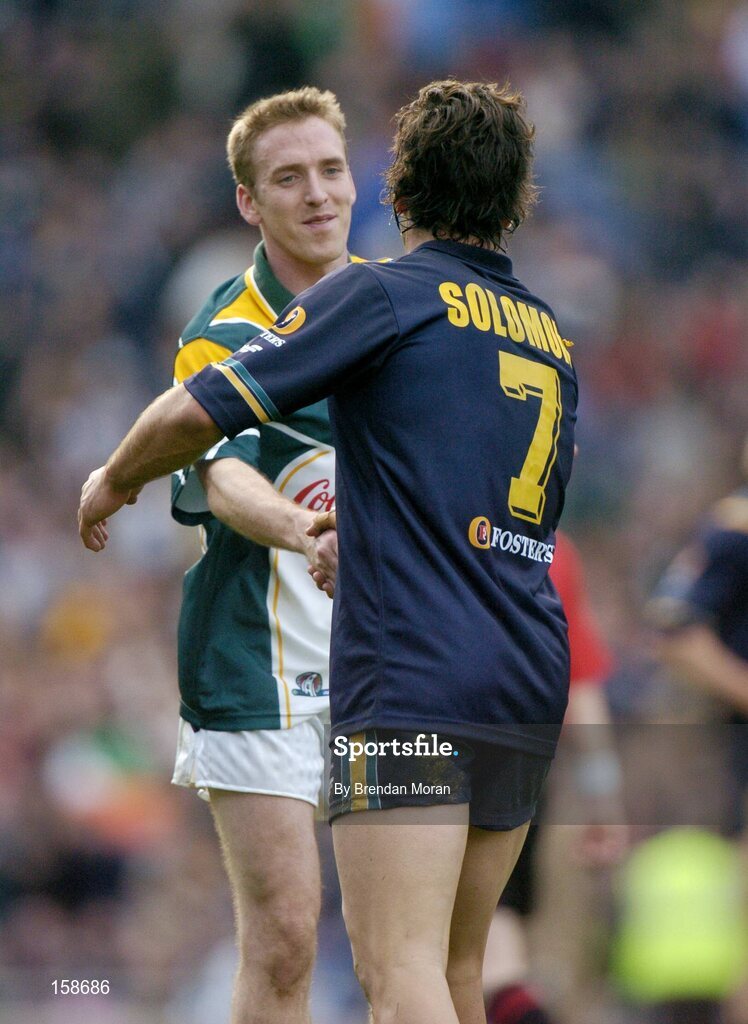 17 October 2004; David Heaney, Ireland, shakes hands with Dean Solomon, Australia, after the final whistle. Coca Cola International Rules Series 2004, First Test, Ireland v Australia, Croke Park, Dublin. Picture credit; Brendan Moran / SPORTSFILE *** Local Caption *** Any photograph taken by SPORTSFILE during, or in connection with, the 2004 Coca Cola International Rules Series which displays GAA logos or contains an image or part of an image of any GAA intellectual property, or, which contains images of a GAA player/players in their playing uniforms, may only be used for editorial and non-advertising purposes.  Use of photographs for advertising, as posters or for purchase separately is strictly prohibited unless prior written approval has been obtained from the Gaelic Athletic Association.