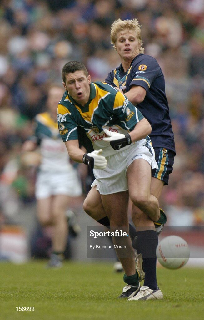 17 October 2004; Sean Cavanagh, Ireland, in action against Nick Riewoldt, Australia. Coca Cola International Rules Series 2004, First Test, Ireland v Australia, Croke Park, Dublin. Picture credit; Brendan Moran / SPORTSFILE *** Local Caption *** Any photograph taken by SPORTSFILE during, or in connection with, the 2004 Coca Cola International Rules Series which displays GAA logos or contains an image or part of an image of any GAA intellectual property, or, which contains images of a GAA player/players in their playing uniforms, may only be used for editorial and non-advertising purposes.  Use of photographs for advertising, as posters or for purchase separately is strictly prohibited unless prior written approval has been obtained from the Gaelic Athletic Association.
