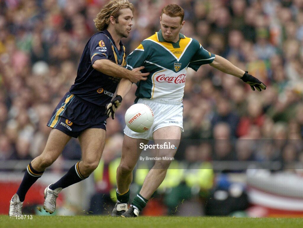 17 October 2004; Brendan Coulter, Ireland, in action against Mark McVeigh, Australia. Coca Cola International Rules Series 2004, First Test, Ireland v Australia, Croke Park, Dublin. Picture credit; Brendan Moran / SPORTSFILE *** Local Caption *** Any photograph taken by SPORTSFILE during, or in connection with, the 2004 Coca Cola International Rules Series which displays GAA logos or contains an image or part of an image of any GAA intellectual property, or, which contains images of a GAA player/players in their playing uniforms, may only be used for editorial and non-advertising purposes.  Use of photographs for advertising, as posters or for purchase separately is strictly prohibited unless prior written approval has been obtained from the Gaelic Athletic Association.