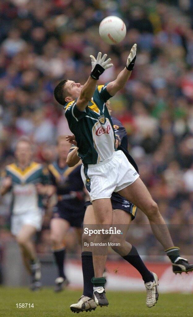 17 October 2004; Sean Cavanagh, Ireland, in action against Nick Riewoldt, Australia. Coca Cola International Rules Series 2004, First Test, Ireland v Australia, Croke Park, Dublin. Picture credit; Brendan Moran / SPORTSFILE *** Local Caption *** Any photograph taken by SPORTSFILE during, or in connection with, the 2004 Coca Cola International Rules Series which displays GAA logos or contains an image or part of an image of any GAA intellectual property, or, which contains images of a GAA player/players in their playing uniforms, may only be used for editorial and non-advertising purposes.  Use of photographs for advertising, as posters or for purchase separately is strictly prohibited unless prior written approval has been obtained from the Gaelic Athletic Association.