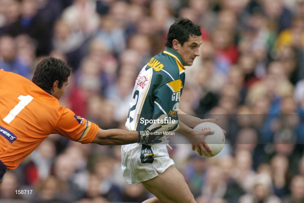 17 October 2004; Paul Galvin, Ireland, in action against Mal Michaels, Australia. Coca Cola International Rules Series 2004, First Test, Ireland v Australia, Croke Park, Dublin. Picture credit; Brendan Moran / SPORTSFILE *** Local Caption *** Any photograph taken by SPORTSFILE during, or in connection with, the 2004 Coca Cola International Rules Series which displays GAA logos or contains an image or part of an image of any GAA intellectual property, or, which contains images of a GAA player/players in their playing uniforms, may only be used for editorial and non-advertising purposes.  Use of photographs for advertising, as posters or for purchase separately is strictly prohibited unless prior written approval has been obtained from the Gaelic Athletic Association.