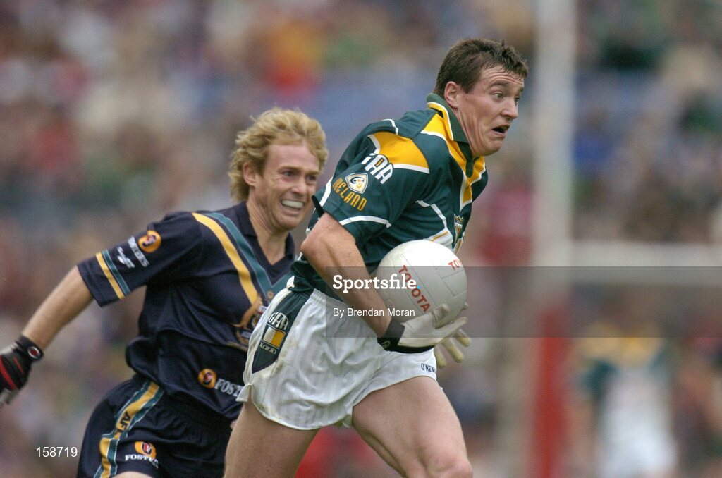 17 October 2004; Ciaran McManus, Ireland, in action against Craig Bolton, Australia. Coca Cola International Rules Series 2004, First Test, Ireland v Australia, Croke Park, Dublin. Picture credit; Brendan Moran / SPORTSFILE *** Local Caption *** Any photograph taken by SPORTSFILE during, or in connection with, the 2004 Coca Cola International Rules Series which displays GAA logos or contains an image or part of an image of any GAA intellectual property, or, which contains images of a GAA player/players in their playing uniforms, may only be used for editorial and non-advertising purposes.  Use of photographs for advertising, as posters or for purchase separately is strictly prohibited unless prior written approval has been obtained from the Gaelic Athletic Association.