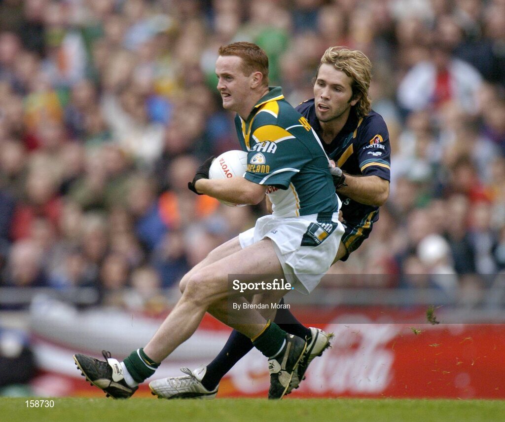 17 October 2004; Brendan Coulter, Ireland, in action against Mark McVeigh, Australia. Coca Cola International Rules Series 2004, First Test, Ireland v Australia, Croke Park, Dublin. Picture credit; Brendan Moran / SPORTSFILE *** Local Caption *** Any photograph taken by SPORTSFILE during, or in connection with, the 2004 Coca Cola International Rules Series which displays GAA logos or contains an image or part of an image of any GAA intellectual property, or, which contains images of a GAA player/players in their playing uniforms, may only be used for editorial and non-advertising purposes.  Use of photographs for advertising, as posters or for purchase separately is strictly prohibited unless prior written approval has been obtained from the Gaelic Athletic Association.