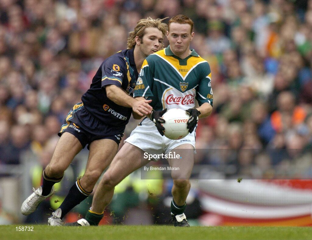 17 October 2004; Brendan Coulter, Ireland, in action against Mark McVeigh, Australia. Coca Cola International Rules Series 2004, First Test, Ireland v Australia, Croke Park, Dublin. Picture credit; Brendan Moran / SPORTSFILE *** Local Caption *** Any photograph taken by SPORTSFILE during, or in connection with, the 2004 Coca Cola International Rules Series which displays GAA logos or contains an image or part of an image of any GAA intellectual property, or, which contains images of a GAA player/players in their playing uniforms, may only be used for editorial and non-advertising purposes.  Use of photographs for advertising, as posters or for purchase separately is strictly prohibited unless prior written approval has been obtained from the Gaelic Athletic Association.