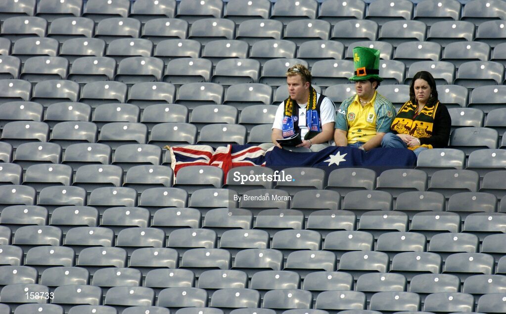 17 October 2004; Australian fans sit in the stand before the game. Coca Cola International Rules Series 2004, First Test, Ireland v Australia, Croke Park, Dublin. Picture credit; Brendan Moran / SPORTSFILE *** Local Caption *** Any photograph taken by SPORTSFILE during, or in connection with, the 2004 Coca Cola International Rules Series which displays GAA logos or contains an image or part of an image of any GAA intellectual property, or, which contains images of a GAA player/players in their playing uniforms, may only be used for editorial and non-advertising purposes.  Use of photographs for advertising, as posters or for purchase separately is strictly prohibited unless prior written approval has been obtained from the Gaelic Athletic Association.