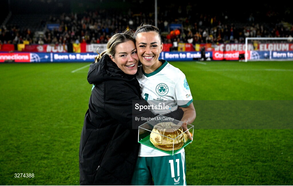 28 October 2025; Republic of Ireland coach Emma Byrne congratulates captain Katie McCabe after receiving her 100th Republic of Ireland international cap following the UEFA Women's Nations League A/B promotion/relegation play-off second leg match between Belgium and Republic of Ireland at The King Power At Den Dreef Stadium in Leuven, Belgium. Photo by Stephen McCarthy/Sportsfile