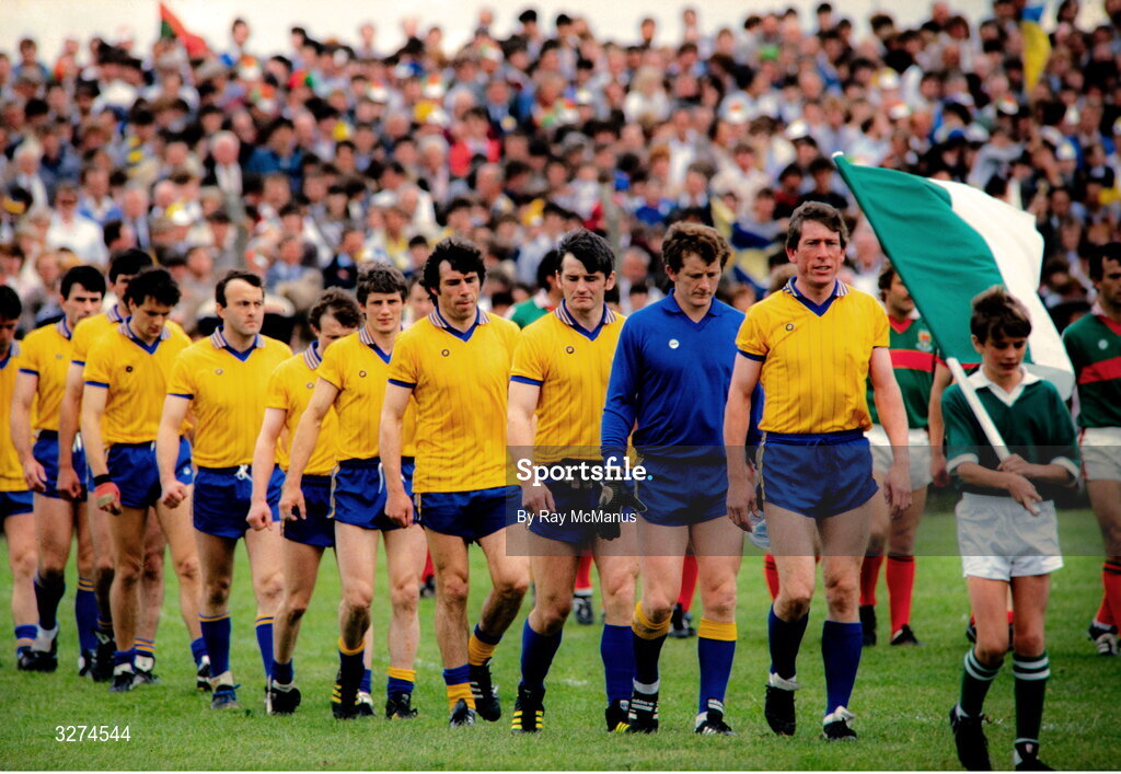 14 July 1985; Roscommon captain Seamus Hayden leads his team in the parade before the Connacht GAA Football Senior Championship Final match between Roscommon and Mayo at Dr Hyde Park in Roscommon. Photo by Ray McManus/Sportsfile