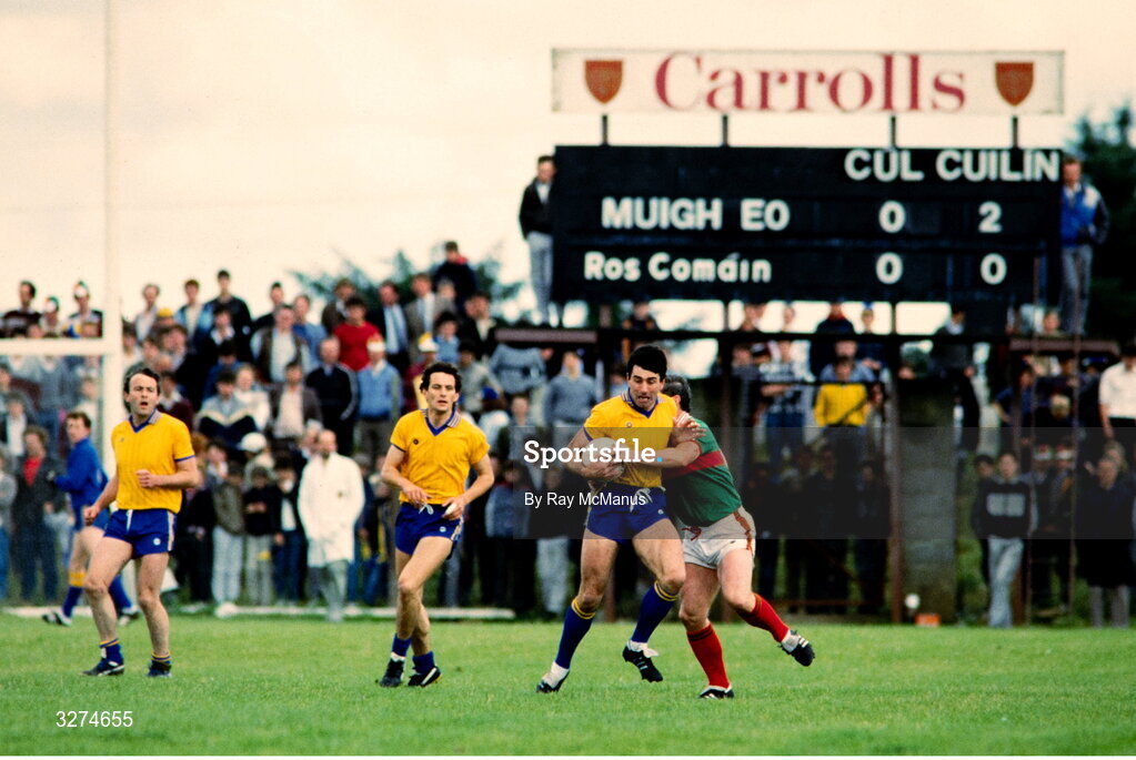 14 July 1985; Dermot Earley of Roscommon is tackled during the Connacht GAA Football Senior Championship Final match between Roscommon and Mayo at Dr Hyde Park in Roscommon. Photo by Ray McManus/Sportsfile