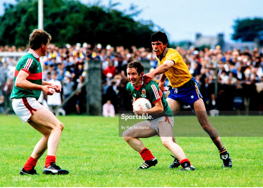 14 July 1985; Eugene McHale of Mayo is tackled by Seamus Killoran of Roscommon during the Connacht GAA Football Senior Championship Final match between Roscommon and Mayo at Dr Hyde Park in Roscommon. Photo by Ray McManus/Sportsfile