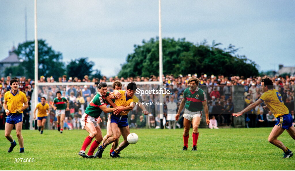 14 July 1985; Seamus Killoran of Roscommon is tackled by Henry Gavin of Mayo during the Connacht GAA Football Senior Championship Final match between Roscommon and Mayo at Dr Hyde Park in Roscommon. Photo by Ray McManus/Sportsfile
