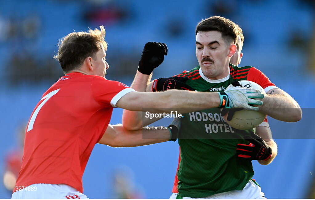 1 November 2025; Ruaidhrí Fallon of St Brigid's is tackled by Mark Richardson, left and Jack Tumulty of Pádraig Pearses during the Roscommon County Senior Club Football Championship Final Replay between St Brigid's and Pádraig Pearses at King & Moffatt Dr Hyde Park in Roscommon. Photo by Tom Beary/Sportsfile