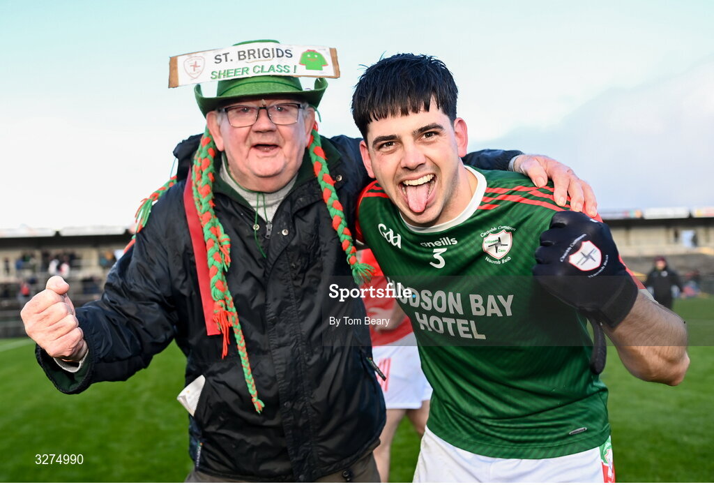 1 November 2025; Sean Trundle of St Brigid's celebrates his side's victory with supporter James Halpin after the Roscommon County Senior Club Football Championship Final Replay between St Brigid's and Pádraig Pearses at King & Moffatt Dr Hyde Park in Roscommon. Photo by Tom Beary/Sportsfile