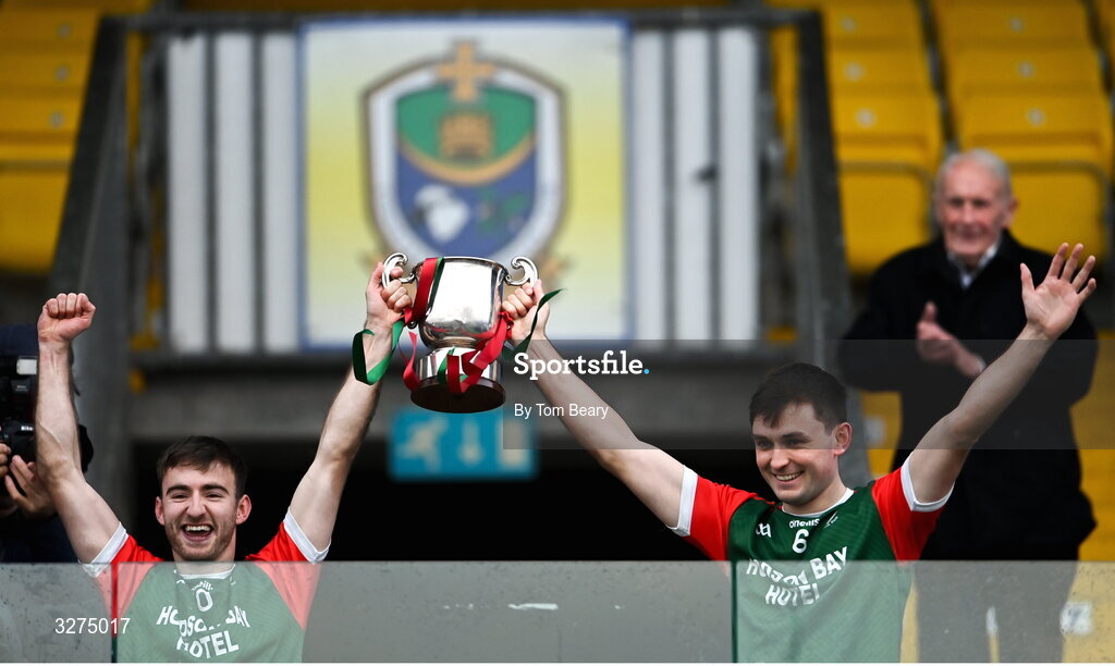 1 November 2025; St Brigid's joint-captains Paul McGrath, left and Brian Stack lift the Fahey Cup after the Roscommon County Senior Club Football Championship Final Replay between St Brigid's and Pádraig Pearses at King & Moffatt Dr Hyde Park in Roscommon. Photo by Tom Beary/Sportsfile