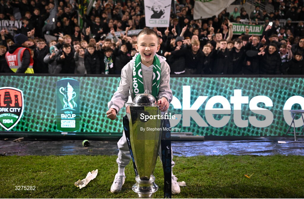 1 November 2025; Josh Bradley son of Shamrock Rovers manager Stephen Bradley celebrates with the trophy after the SSE Airtricity Men's Premier Division match between Shamrock Rovers and Sligo Rovers at Tallaght Stadium in Dublin. Photo by Stephen McCarthy/Sportsfile