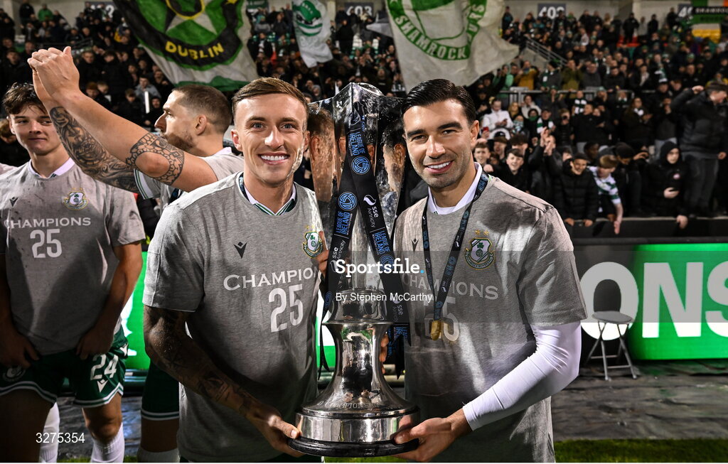 1 November 2025; Danny Grant, left, and Danny Mandroiu of Shamrock Rovers celebrate with the trophy after the SSE Airtricity Men's Premier Division match between Shamrock Rovers and Sligo Rovers at Tallaght Stadium in Dublin. Photo by Stephen McCarthy/Sportsfile