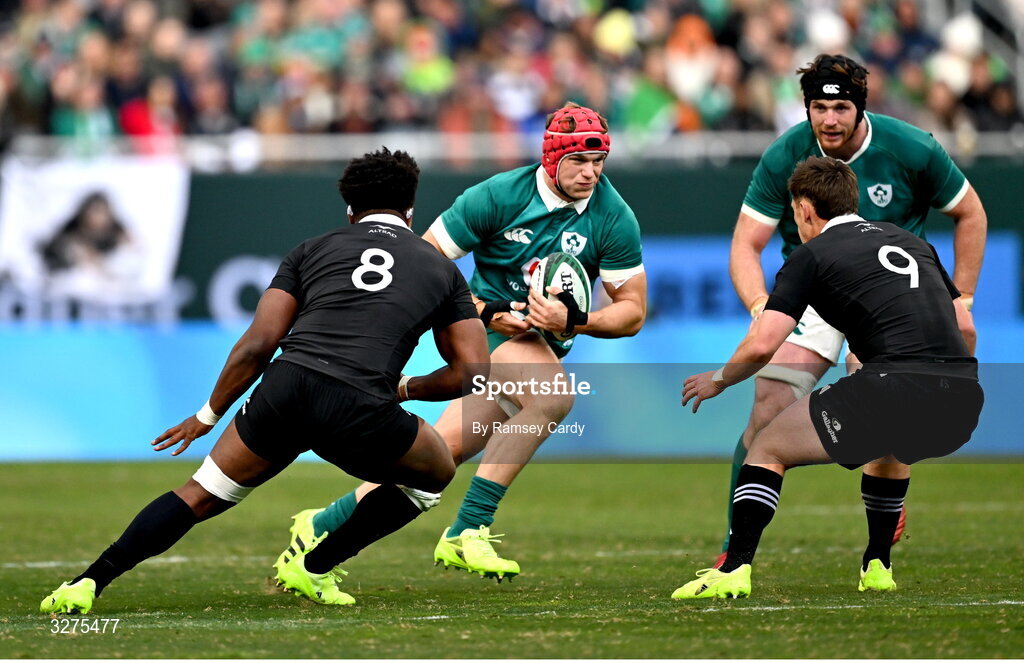 1 November 2025; Josh van der Flier of Ireland in action against Peter Lakai, left, and Cam Roigard of New Zealand during the Gallagher Cup match between Ireland and New Zealand at Soldier Field in Chicago, USA. Photo by Ramsey Cardy/Sportsfile