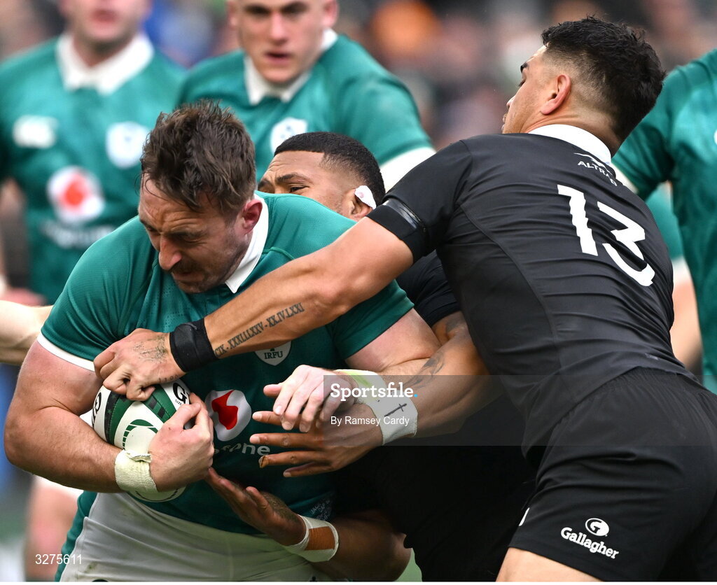 1 November 2025; Jack Conan of Ireland is tackled by Quinn Tupaea of New Zealand during the Gallagher Cup match between Ireland and New Zealand at Soldier Field in Chicago, USA. Photo by Ramsey Cardy/Sportsfile