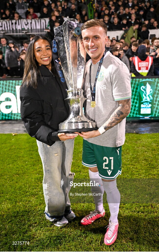 1 November 2025; Danny Grant of Shamrock Rovers and his partner Niyah celebrate with the SSE Airtricity Men's Premier Division trophy after the SSE Airtricity Men's Premier Division match between Shamrock Rovers and Sligo Rovers at Tallaght Stadium in Dublin.  Photo by Stephen McCarthy/Sportsfile