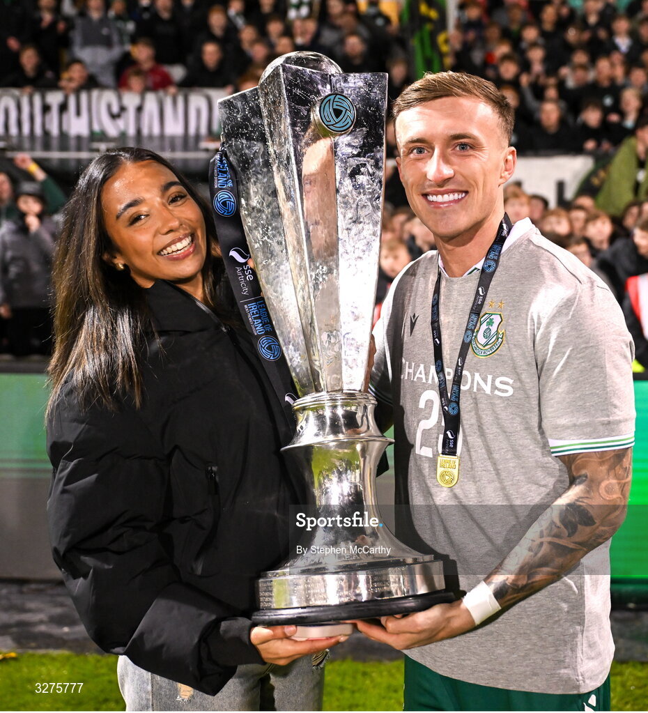 1 November 2025; Danny Grant of Shamrock Rovers and his partner Niyah celebrate with the SSE Airtricity Men's Premier Division trophy after the SSE Airtricity Men's Premier Division match between Shamrock Rovers and Sligo Rovers at Tallaght Stadium in Dublin.  Photo by Stephen McCarthy/Sportsfile