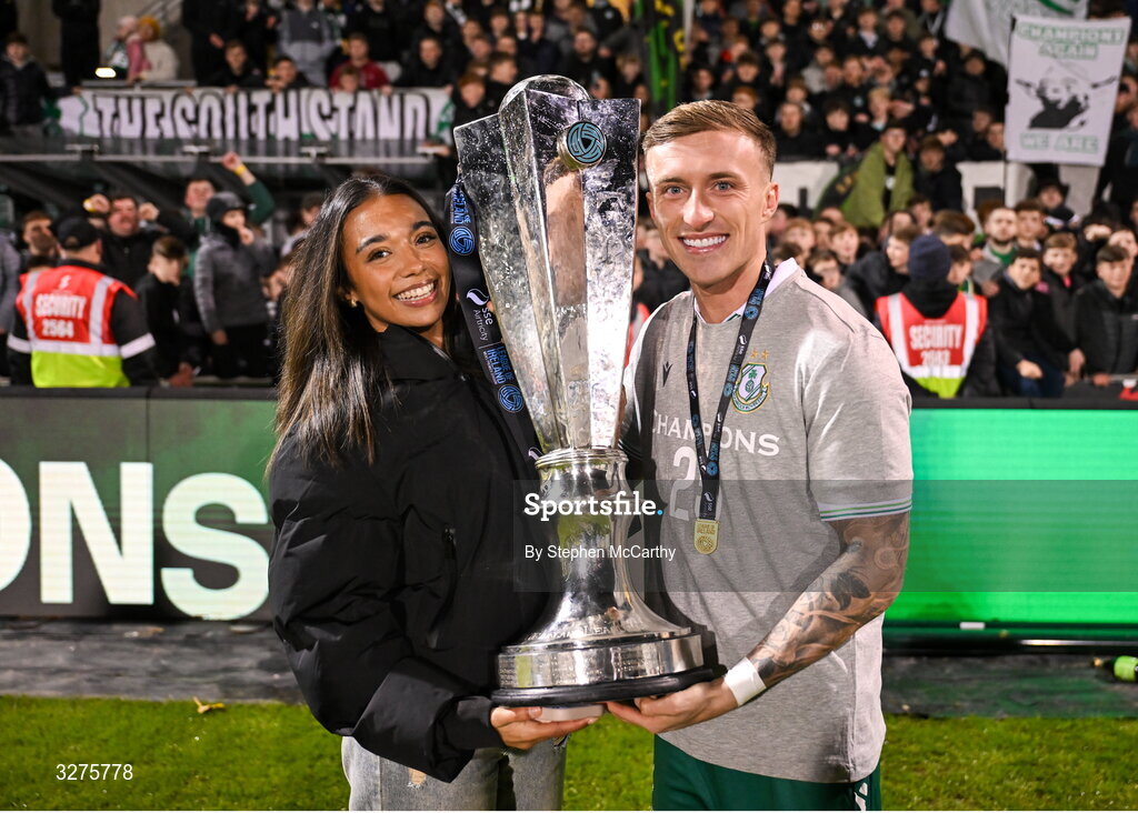 1 November 2025; Danny Grant of Shamrock Rovers and his partner Niyah celebrate with the SSE Airtricity Men's Premier Division trophy after the SSE Airtricity Men's Premier Division match between Shamrock Rovers and Sligo Rovers at Tallaght Stadium in Dublin.  Photo by Stephen McCarthy/Sportsfile