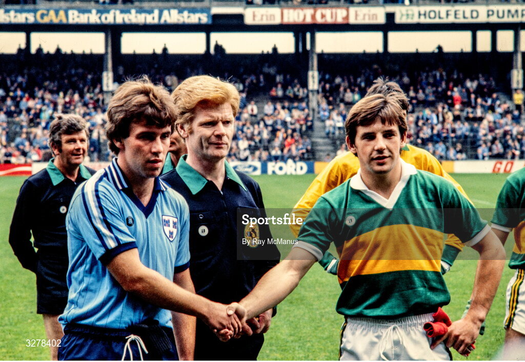 19 September 1982; Dublin captain Liam O'Rourke, left, shake hands with Kerry captain Michael McAuliffe across the referee Johnny Heaney  before the All-Ireland Minor Football Final match between Dublin and Kerry at Croke Park, Dublin. Photo by Ray McManus/Sportsfile