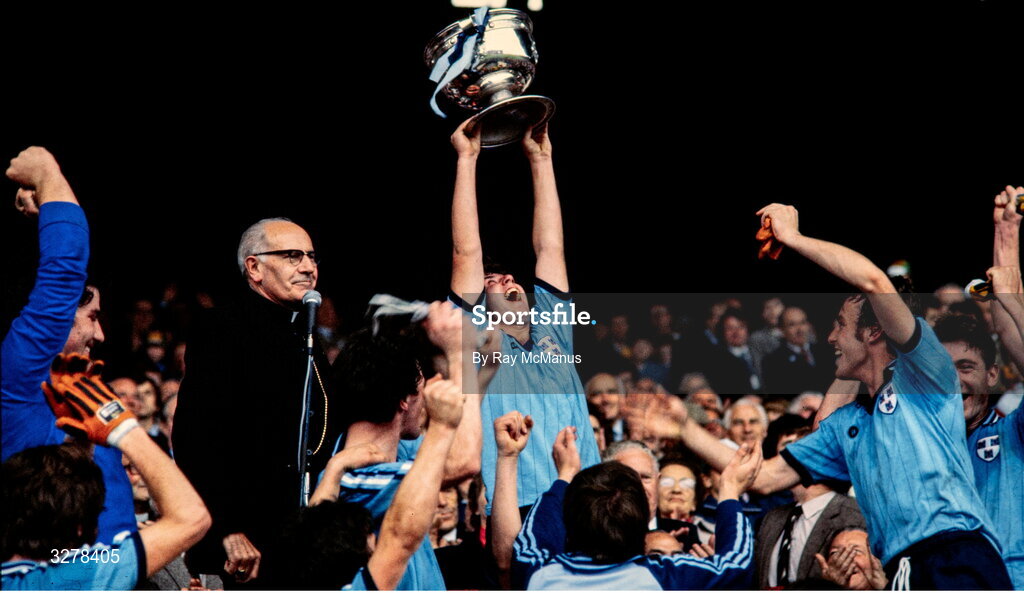 19 September 1982; Dublin captain Liam O'Rourke lifts the Irish Press cup, in the company of Archbishop of Cashel & Emly Dr Thomas Morris, after their side's victory in the All-Ireland Minor Football Final match between Dublin and Kerry at Croke Park, Dublin. Photo by Ray McManus/Sportsfile