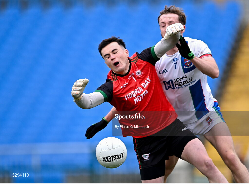 16 November 2025; St Brigid's goalkeeper Conor Carroll in action against David Tighe of Ballina Stephenites during the AIB Connacht GAA Football Senior Club Championship semi-final match between St Brigid's and Ballina Stephenites at King & Moffatt Dr Hyde Park in Roscommon. Photo by Piaras Ó Mídheach/Sportsfile