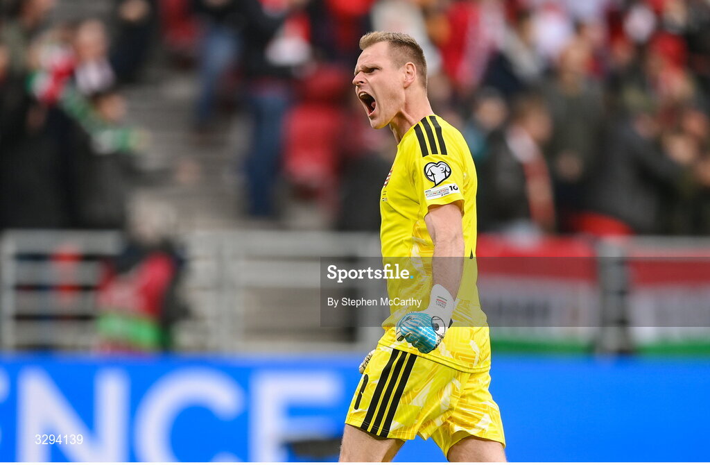 16 November 2025; Hungary goalkeeper Dénes Dibusz celebrates his side's first goal, scored by Dániel Lukács, during the FIFA World Cup 2026 Group F Qualifier match between Hungary and Republic of Ireland at Puskás Aréna in Budapest, Hungary. Photo by Stephen McCarthy/Sportsfile
