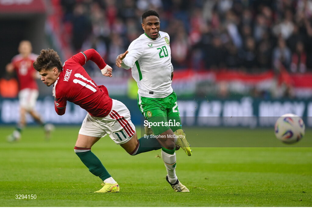 16 November 2025; Chiedozie Ogbene of Republic of Ireland and Milos Kerkez of Hungary during the FIFA World Cup 2026 Group F Qualifier match between Hungary and Republic of Ireland at Puskás Aréna in Budapest, Hungary. Photo by Stephen McCarthy/Sportsfile
