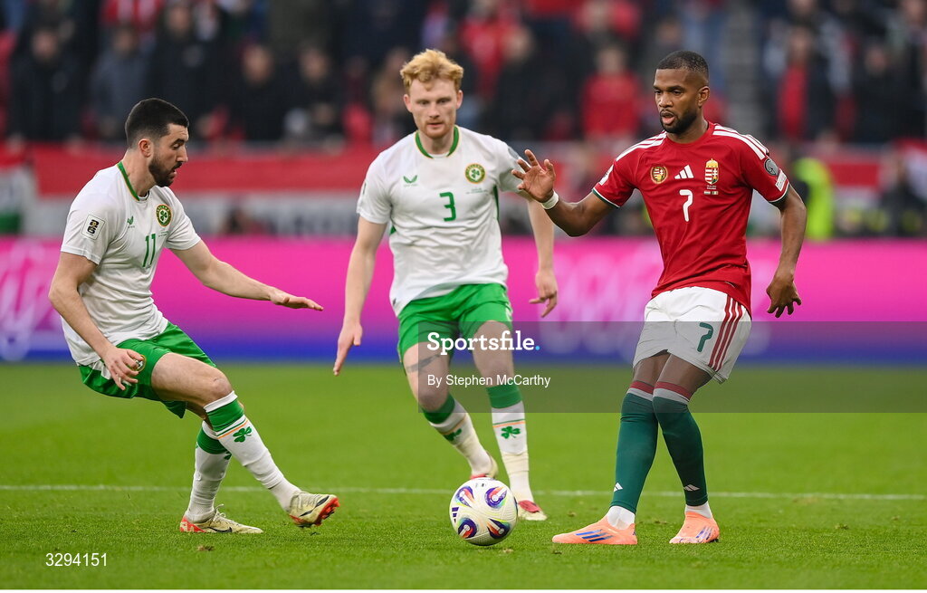 16 November 2025; Loïc Négo of Hungary in action against Finn Azaz, left, and Liam Scales of Republic of Ireland during the FIFA World Cup 2026 Group F Qualifier match between Hungary and Republic of Ireland at Puskás Aréna in Budapest, Hungary. Photo by Stephen McCarthy/Sportsfile