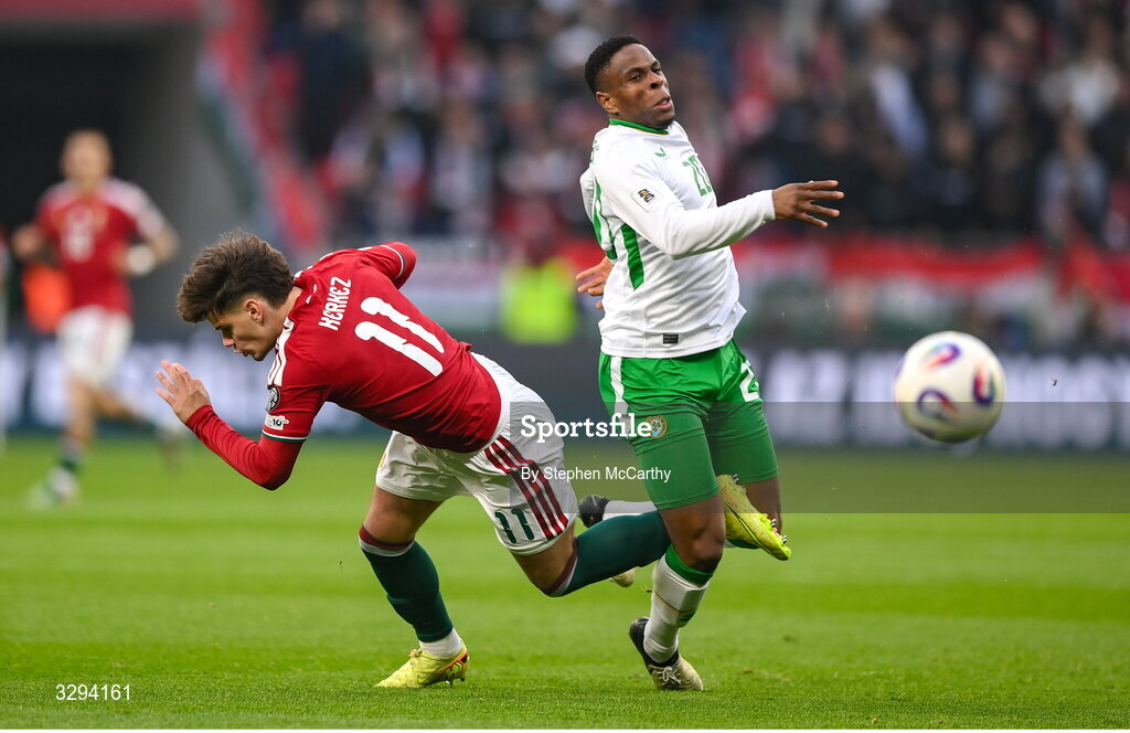 16 November 2025; Chiedozie Ogbene of Republic of Ireland and Milos Kerkez of Hungary during the FIFA World Cup 2026 Group F Qualifier match between Hungary and Republic of Ireland at Puskás Aréna in Budapest, Hungary. Photo by Stephen McCarthy/Sportsfile
