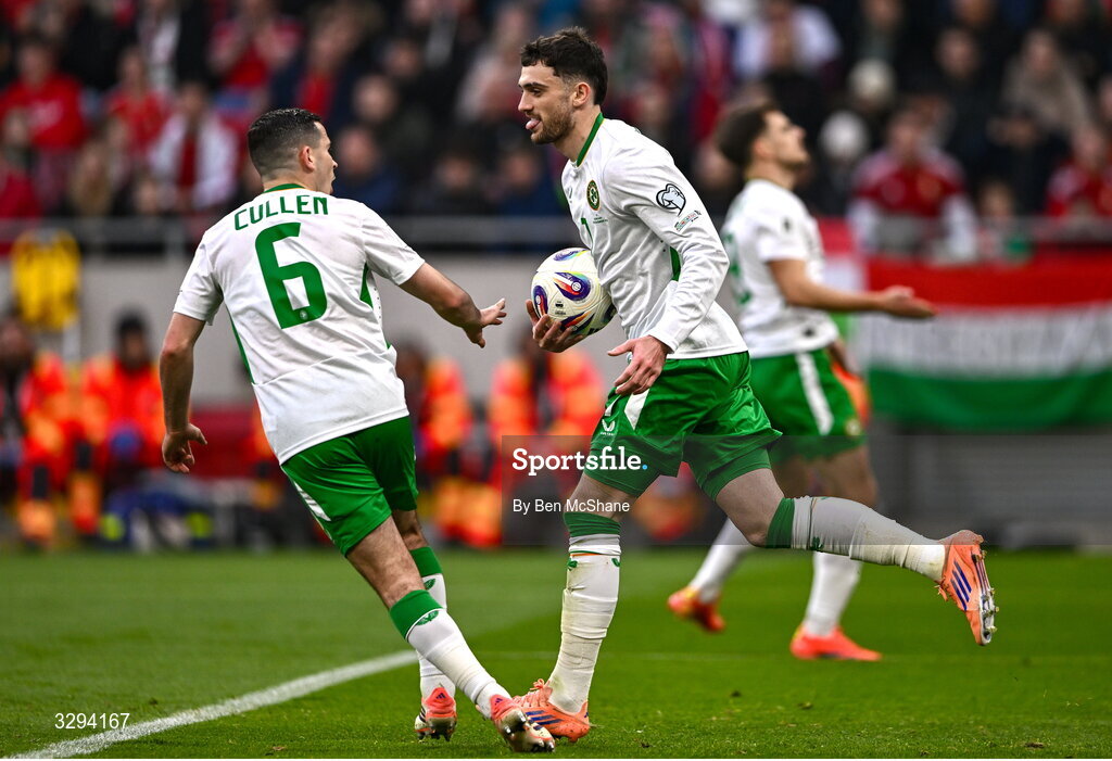 16 November 2025; Troy Parrott of Republic of Ireland celebrates after scoring his side's first goal with teammate Josh Cullen, 6, during the FIFA World Cup 2026 Group F Qualifier match between Hungary and Republic of Ireland at Puskás Aréna in Budapest, Hungary. Photo by Ben McShane/Sportsfile