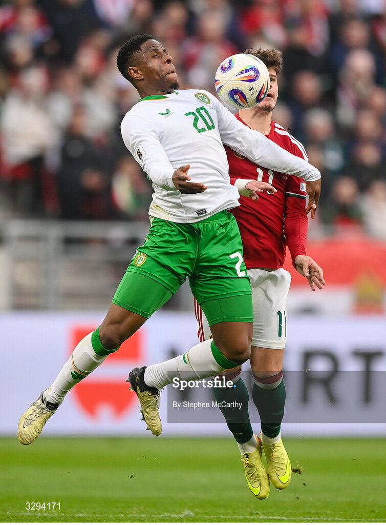 16 November 2025; Chiedozie Ogbene of Republic of Ireland in action against Milos Kerkez of Hungary during the FIFA World Cup 2026 Group F Qualifier match between Hungary and Republic of Ireland at Puskás Aréna in Budapest, Hungary. Photo by Stephen McCarthy/Sportsfile