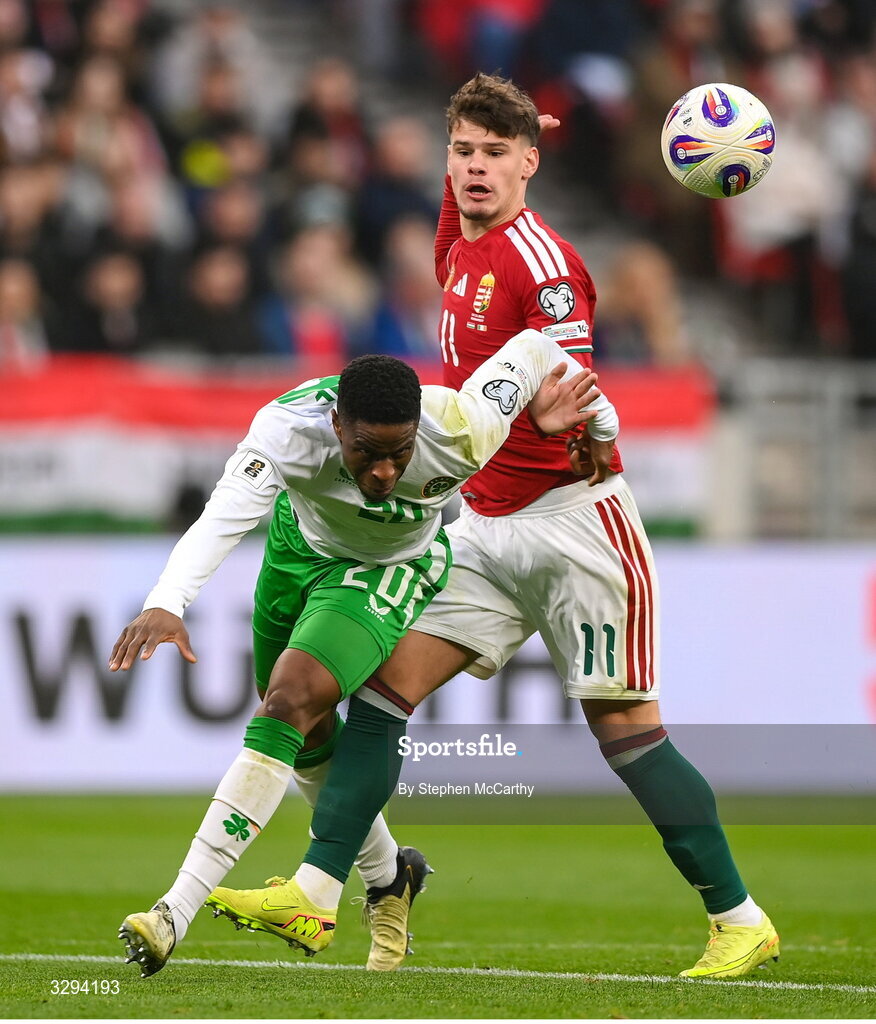 16 November 2025; Chiedozie Ogbene of Republic of Ireland in action against Milos Kerkez of Hungary during the FIFA World Cup 2026 Group F Qualifier match between Hungary and Republic of Ireland at Puskás Aréna in Budapest, Hungary. Photo by Stephen McCarthy/Sportsfile