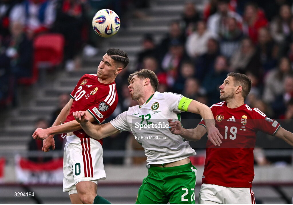 16 November 2025; Roland Sallai, left, and Barnabás Varga of Hungary in action against Nathan Collins of Republic of Ireland during the FIFA World Cup 2026 Group F Qualifier match between Hungary and Republic of Ireland at Puskás Aréna in Budapest, Hungary. Photo by Ben McShane/Sportsfile