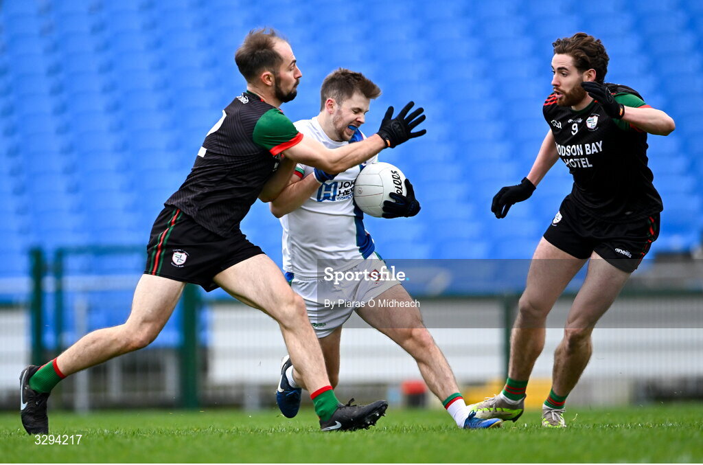16 November 2025; Conor McStay of Ballina Stephenites in action against Ruairí Smith, left, and Eddie Nolan of St Brigid's during the AIB Connacht GAA Football Senior Club Championship semi-final match between St Brigid's and Ballina Stephenites at King & Moffatt Dr Hyde Park in Roscommon. Photo by Piaras Ó Mídheach/Sportsfile