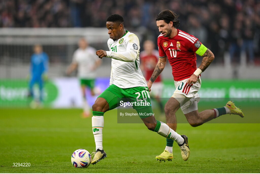 16 November 2025; Chiedozie Ogbene of Republic of Ireland in action against Dominik Szoboszlai of Hungary during the FIFA World Cup 2026 Group F Qualifier match between Hungary and Republic of Ireland at Puskás Aréna in Budapest, Hungary. Photo by Stephen McCarthy/Sportsfile