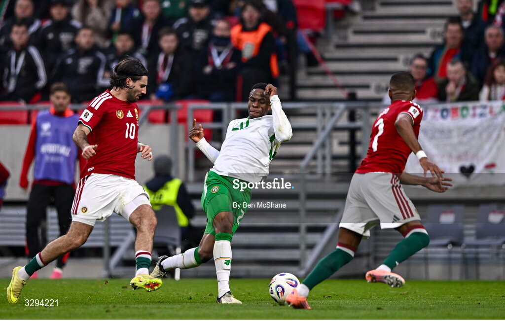 16 November 2025; Chiedozie Ogbene of Republic of Ireland in action against Dominik Szoboszlai, left, and Loïc Négo of Hungary during the FIFA World Cup 2026 Group F Qualifier match between Hungary and Republic of Ireland at Puskás Aréna in Budapest, Hungary. Photo by Ben McShane/Sportsfile