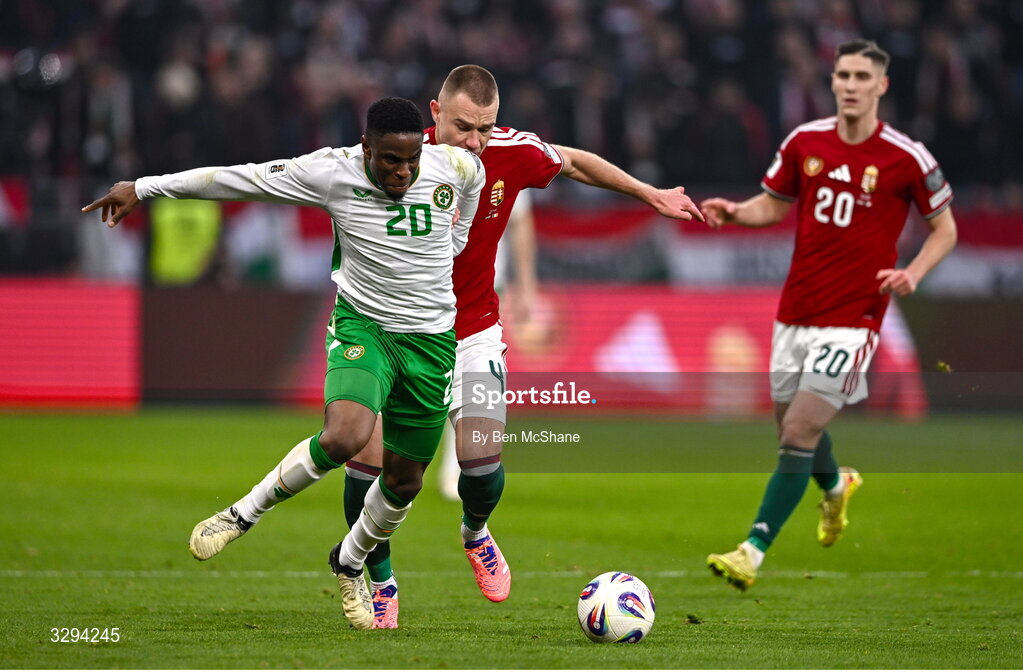 16 November 2025; Chiedozie Ogbene of Republic of Ireland in action against Attila Szalai of Hungary during the FIFA World Cup 2026 Group F Qualifier match between Hungary and Republic of Ireland at Puskás Aréna in Budapest, Hungary. Photo by Ben McShane/Sportsfile