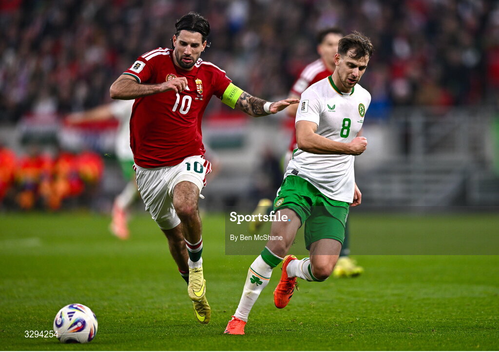 16 November 2025; Jayson Molumby of Republic of Ireland in action against Dominik Szoboszlai of Hungary during the FIFA World Cup 2026 Group F Qualifier match between Hungary and Republic of Ireland at Puskás Aréna in Budapest, Hungary. Photo by Ben McShane/Sportsfile